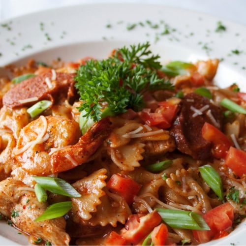 Cajun shrimp with bowties and roasted vegetables